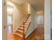 Hallway with hardwood floors leading to the staircase and other rooms at 117 Biscayne Ct, Mooresville, NC 28117