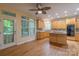 Bright kitchen with wood cabinets, granite countertops, stainless appliances, and hardwood floors at 117 Biscayne Ct, Mooresville, NC 28117