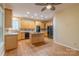 Spacious kitchen with island, stainless appliances, and hardwood floors at 117 Biscayne Ct, Mooresville, NC 28117