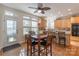 Eat-in kitchen with a glass-top table, wood chairs, and access to the backyard at 117 Biscayne Ct, Mooresville, NC 28117