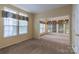 Open living room with large windows and carpet at 117 Biscayne Ct, Mooresville, NC 28117