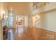 Bright living room with hardwood floors, fireplace, and view into the kitchen at 117 Biscayne Ct, Mooresville, NC 28117