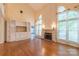 Bright living room with hardwood floors, a fireplace, and a built-in entertainment center at 117 Biscayne Ct, Mooresville, NC 28117