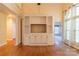 Open living space with hardwood floors and a large built-in entertainment center at 117 Biscayne Ct, Mooresville, NC 28117