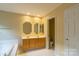 Bright main bathroom with double vanity and tile flooring at 117 Biscayne Ct, Mooresville, NC 28117