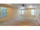 Large main bedroom with carpet, ceiling fan and natural light from multiple windows at 117 Biscayne Ct, Mooresville, NC 28117
