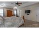 Main bedroom with carpeted floor, ceiling fan, and en-suite bath at 117 Biscayne Ct, Mooresville, NC 28117