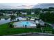 Aerial view of community pool and lake access, perfect for summer fun and relaxation at 117 Biscayne Ct, Mooresville, NC 28117