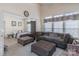 Bright sitting area with two sofas, ottomans, and view into bedroom at 117 Biscayne Ct, Mooresville, NC 28117