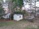 White storage shed in backyard with fence at 117 Biscayne Ct, Mooresville, NC 28117