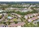 Extensive aerial view of the community showcasing the pool, landscaping, parking, and nearby highway access at 11735 Ridgeway Park Dr, Charlotte, NC 28277