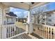 White balcony overlooking a manicured lawn and mature shade trees at 11735 Ridgeway Park Dr, Charlotte, NC 28277