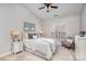 Cozy bedroom with a high ceiling, a comfortable bed and a neutral color palette at 11735 Ridgeway Park Dr, Charlotte, NC 28277