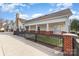 Exterior view of the property, featuring a fence, manicured lawn and covered porch at 11735 Ridgeway Park Dr, Charlotte, NC 28277