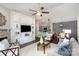 Open-concept living room with built-ins, fireplace, and view of the kitchen and dining area at 11735 Ridgeway Park Dr, Charlotte, NC 28277