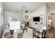 Bright living room featuring a stone fireplace, built-in shelving, and contemporary decor at 11735 Ridgeway Park Dr, Charlotte, NC 28277