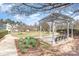 Inviting park area with a pergola, benches, picnic tables, and grills for outdoor enjoyment and relaxation at 11735 Ridgeway Park Dr, Charlotte, NC 28277