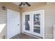 Porch with weathered wood deck, beige siding and a view of adjacent building at 11735 Ridgeway Park Dr, Charlotte, NC 28277