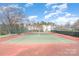 Well-maintained outdoor tennis court with fencing, offering a great recreational amenity at 11735 Ridgeway Park Dr, Charlotte, NC 28277