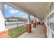 Covered walkway with brick pillars, providing a charming view of the community pool and other buildings at 11735 Ridgeway Park Dr, Charlotte, NC 28277