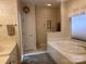 Bathroom with garden tub and double vanity at 1180 Asheford Green Ave # 46, Concord, NC 28027