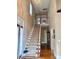 Elegant entryway with hardwood floors and a grand staircase at 1180 Asheford Green Ave # 46, Concord, NC 28027