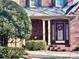 Elegant front entrance with a red door and landscaped entryway at 1180 Asheford Green Ave # 46, Concord, NC 28027