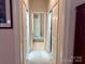 Hallway with closets and access to other rooms at 1180 Asheford Green Ave # 46, Concord, NC 28027