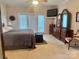 Spacious main bedroom with ample closet space and private access to deck at 1180 Asheford Green Ave # 46, Concord, NC 28027