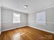 Bright bedroom featuring hardwood floors and large windows at 1215 Neal Hawkins Rd, Gastonia, NC 28056