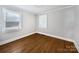 Simple bedroom with hardwood floors and neutral-toned walls at 1215 Neal Hawkins Rd, Gastonia, NC 28056