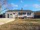 White house exterior with a detached garage and landscaping at 1215 Neal Hawkins Rd, Gastonia, NC 28056