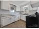 Renovated kitchen with white cabinets and grey countertops at 1215 Neal Hawkins Rd, Gastonia, NC 28056