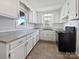 Renovated kitchen with white cabinets and grey countertops at 1215 Neal Hawkins Rd, Gastonia, NC 28056