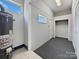 Laundry area with linoleum floor, storage, and water heater at 1215 Neal Hawkins Rd, Gastonia, NC 28056