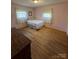 Light and airy bedroom with hardwood floors and window coverings at 1217 Burke Rd, Shelby, NC 28152