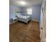 Bright bedroom with hardwood floors, a full-size bed, and a window at 1217 Burke Rd, Shelby, NC 28152