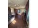 Gathering room with brick fireplace and view into kitchen at 1217 Burke Rd, Shelby, NC 28152