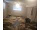 Unfinished basement with new flooring installation in progress at 1309 Poplar Cir, Newton, NC 28658