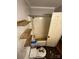 Small bathroom with bathtub, toilet, and wooden shelves at 1309 Poplar Cir, Newton, NC 28658