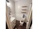 Simple bathroom with white vanity, toilet, and shelves at 1309 Poplar Cir, Newton, NC 28658