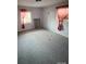 Spacious bedroom with grey carpet and two windows at 1309 Poplar Cir, Newton, NC 28658