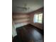 Bedroom with pink walls, ceiling fan, and dark wood flooring at 1309 Poplar Cir, Newton, NC 28658