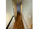 Long hallway with light walls and wood-look flooring at 1309 Poplar Cir, Newton, NC 28658