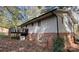 Side view showing a brick foundation and deck at 1309 Poplar Cir, Newton, NC 28658