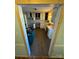 View of kitchen from doorway, white cabinets, and wood-look flooring at 1309 Poplar Cir, Newton, NC 28658