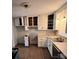 Bright kitchen with white cabinets and laminate floor at 1309 Poplar Cir, Newton, NC 28658