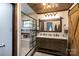 Modern bathroom with double vanity and walk-in shower at 1432 Jules Ct, Charlotte, NC 28226