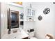 Small bathroom with a pedestal sink and a built-in cabinet at 1432 Jules Ct, Charlotte, NC 28226