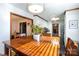 Bright dining area with wood table and view into kitchen at 1432 Jules Ct, Charlotte, NC 28226